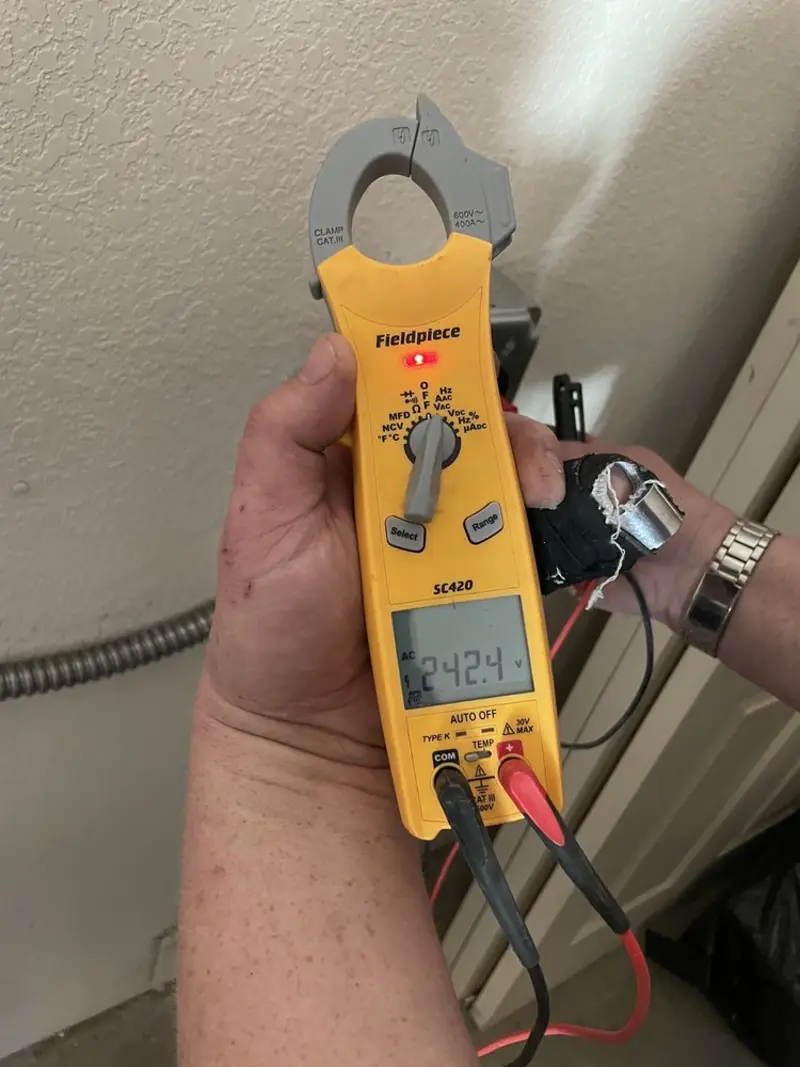 Voltage testing with clamp meter during Generator Installation in Siesta Key